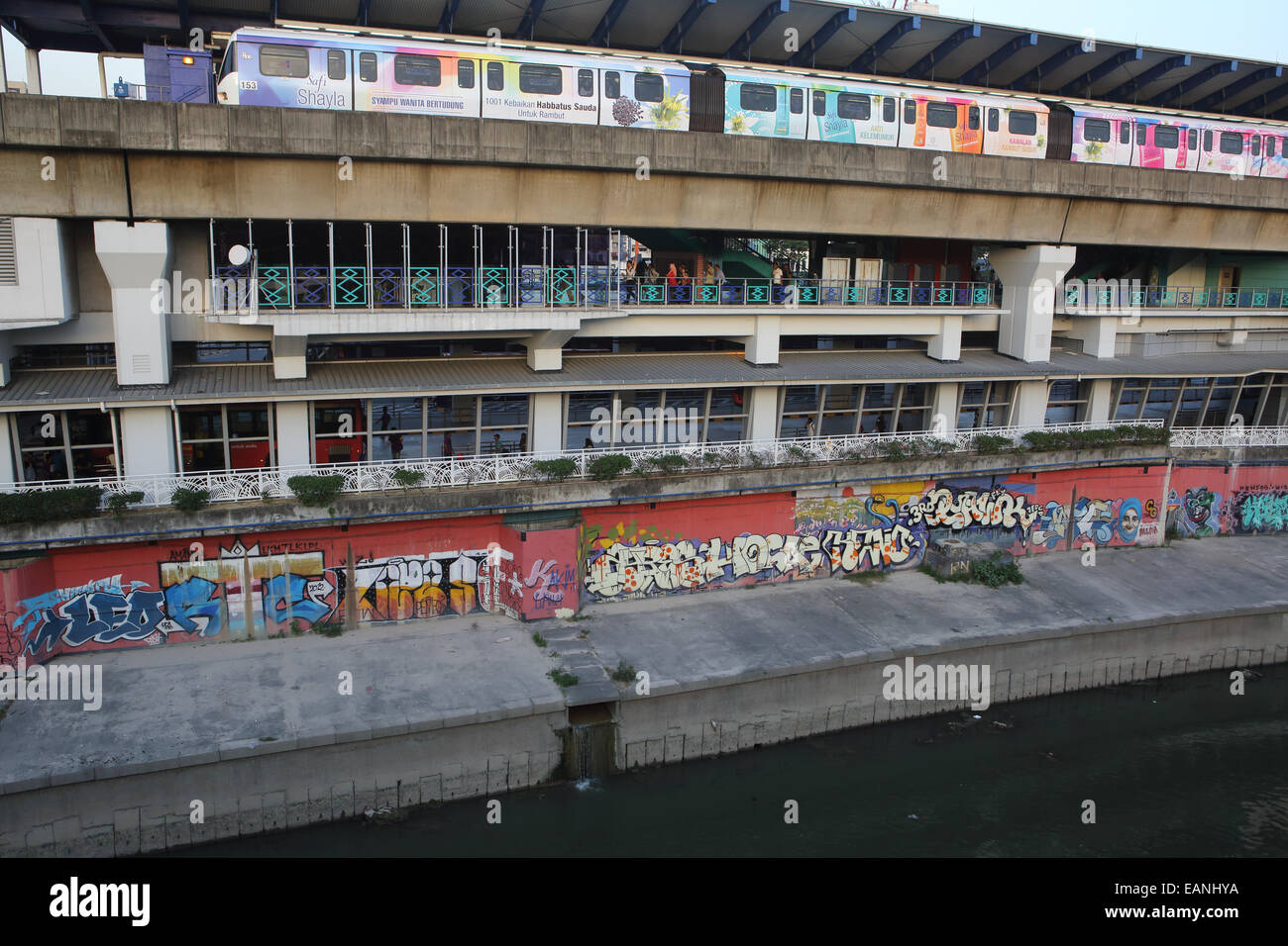 Metro Train At Pasar Seni Train Station Next To Canal In Kuala Stock Photo Alamy