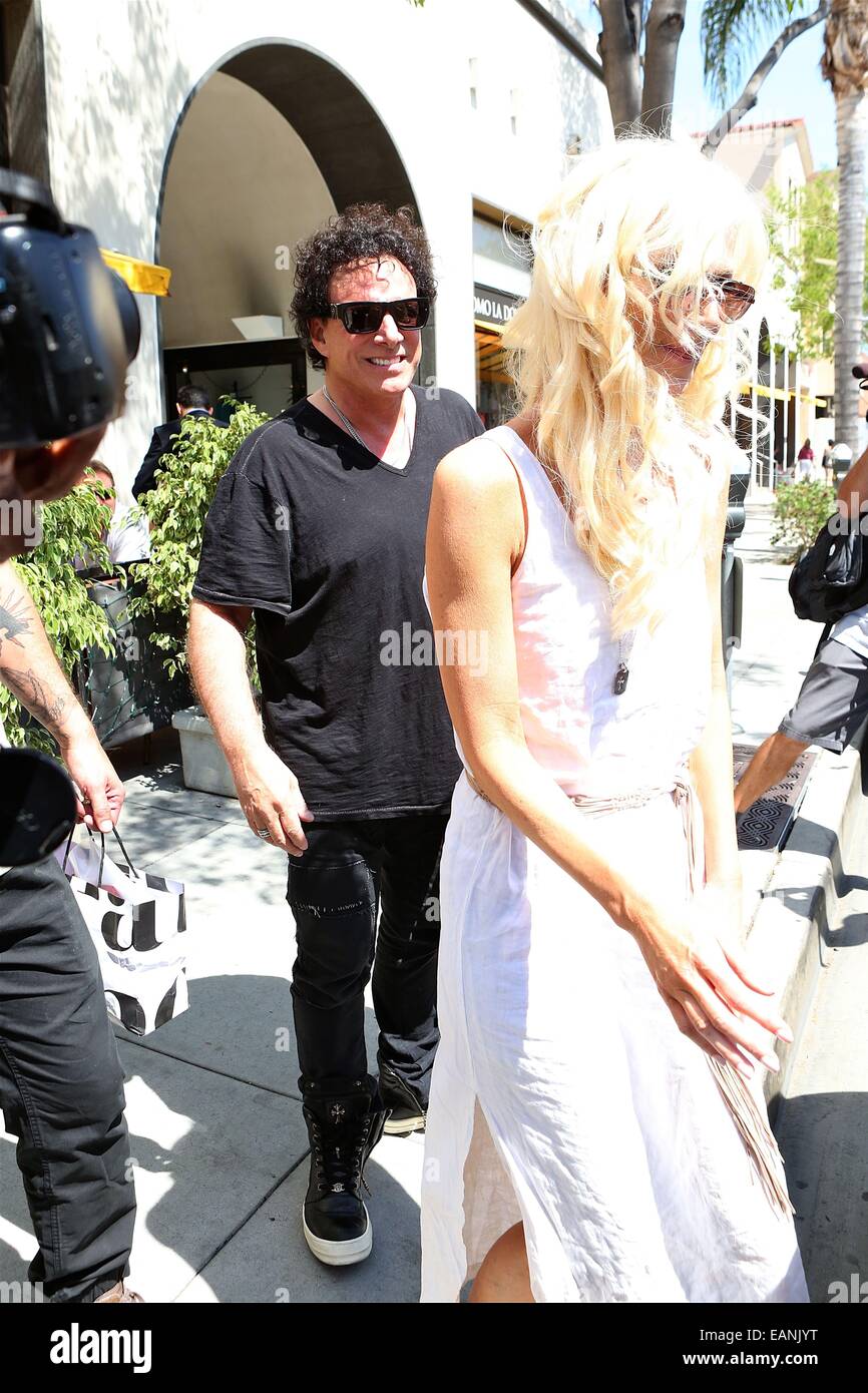 Neal Schon of Journey and wife Michaele Salahi leave Giuseppe Franco Salon in Beverly Hills  Featuring: Neal Schon,Michaele Salahi Where: Los Angeles, California, United States When: 16 May 2014 Stock Photo