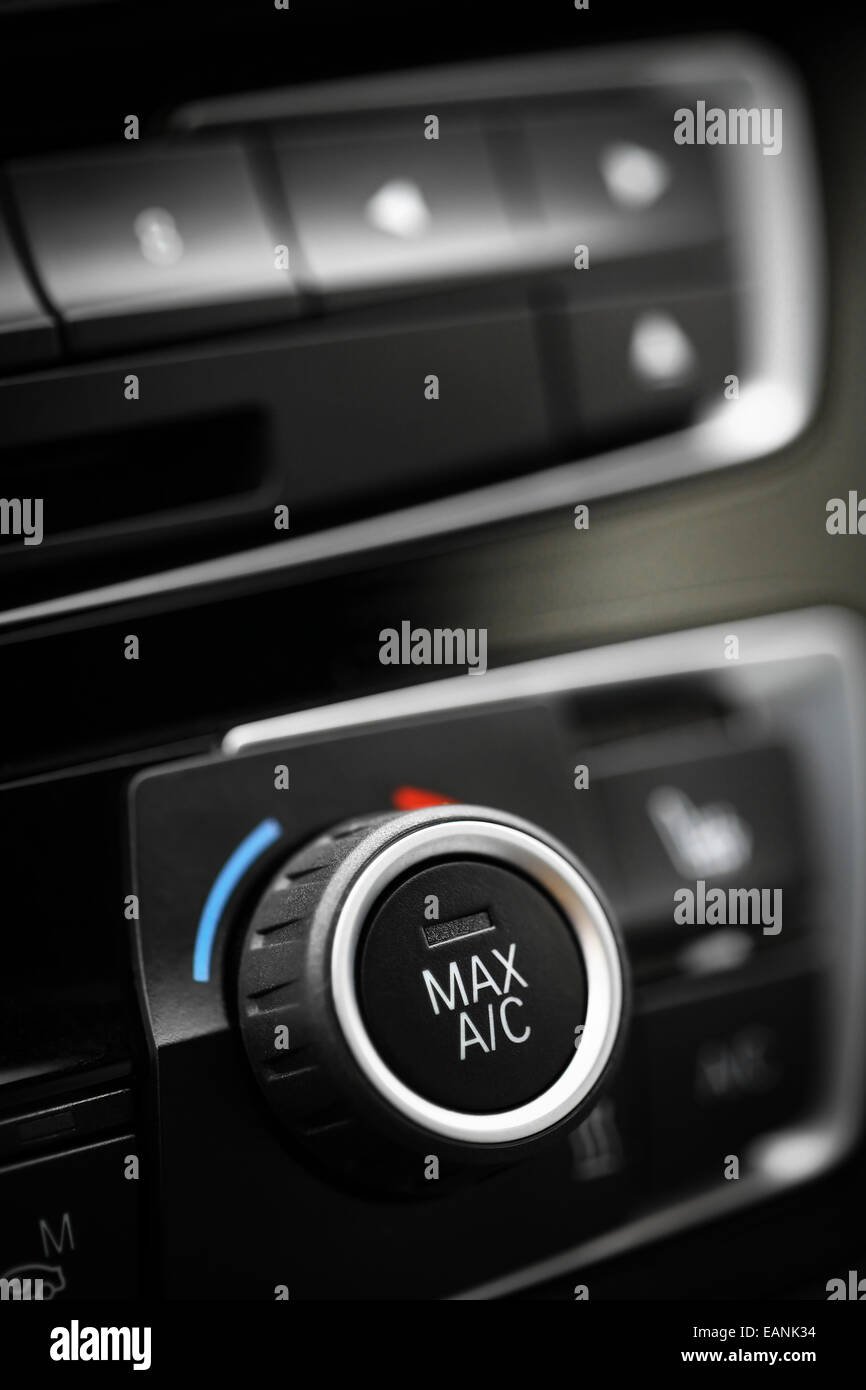 Color detail with the air conditioning button inside a car Stock Photo