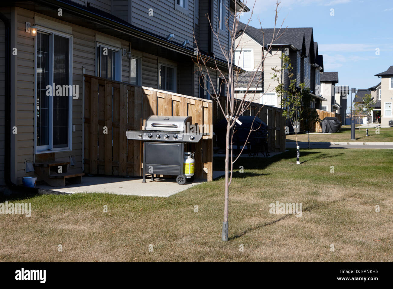 bbqs in small back yards of suburban homes saskatoon Saskatchewan Canada Stock Photo