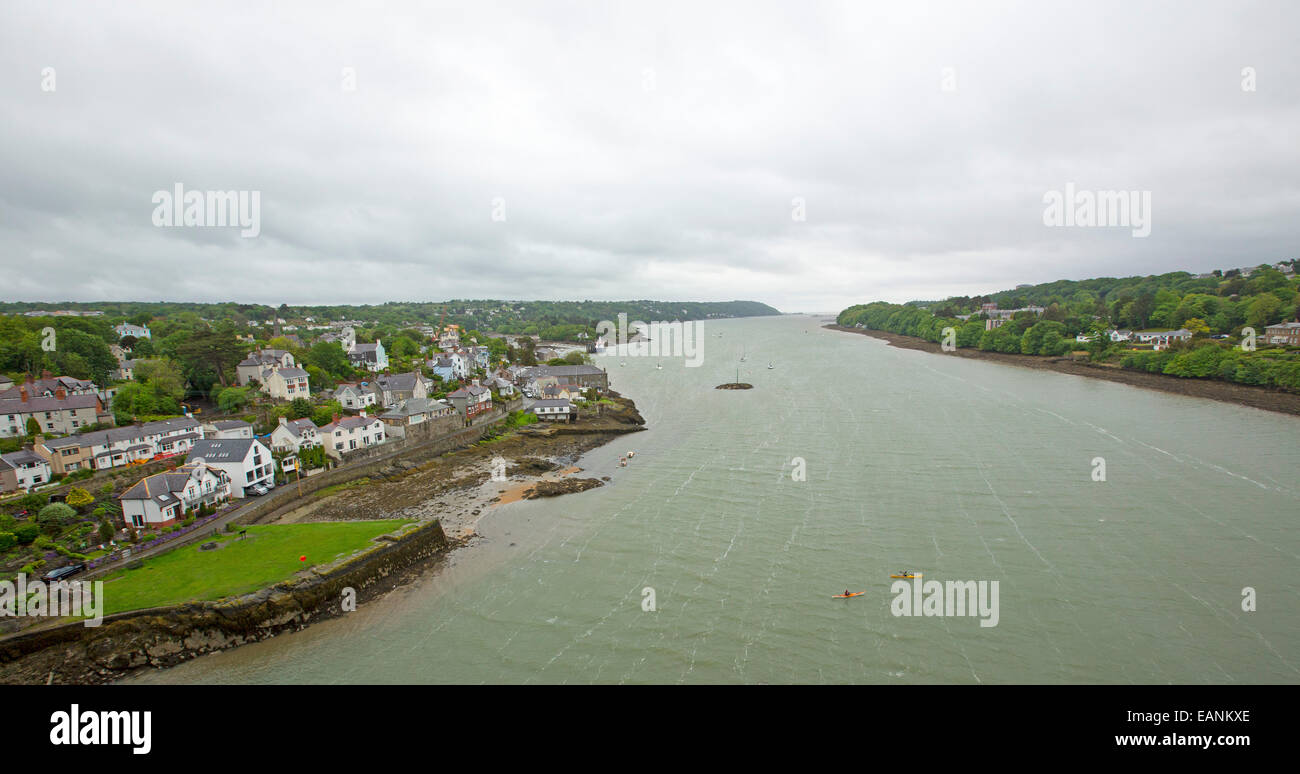 View, from high suspension bridge over wide Menai Strait, of town of Beaumaris on Isle of Anglesey & coast of Welsh mainland Stock Photo