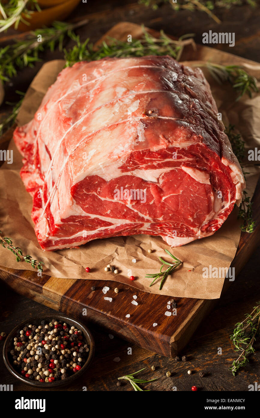 Raw Grass Fed Prime Rib Meat with Herbs and Spices Stock Photo