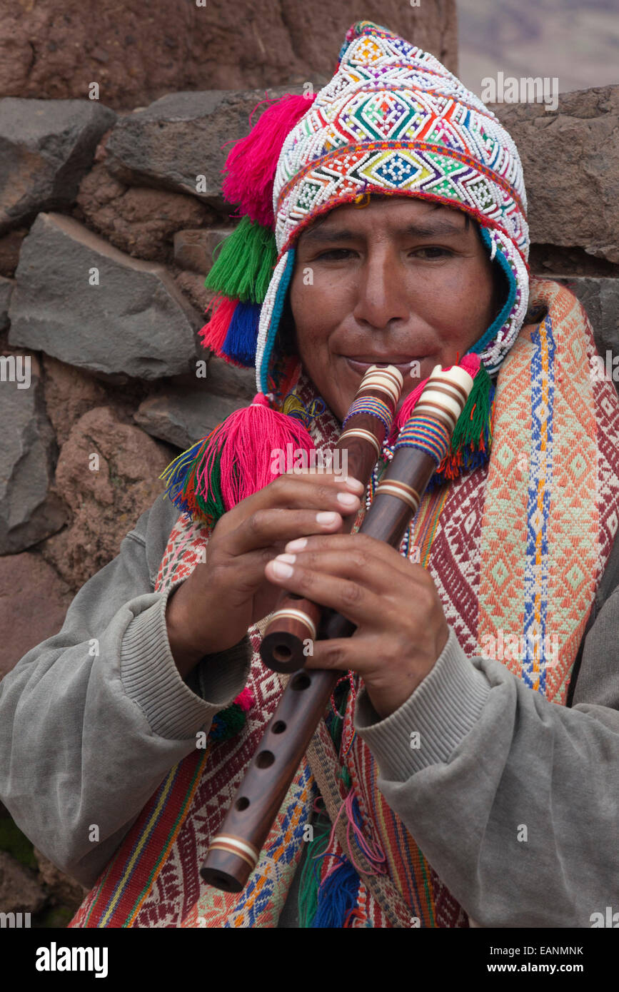 Peruvian man in traditional clothes playing the flute, Sacred Valley, Peru,  South America Stock Photo - Alamy
