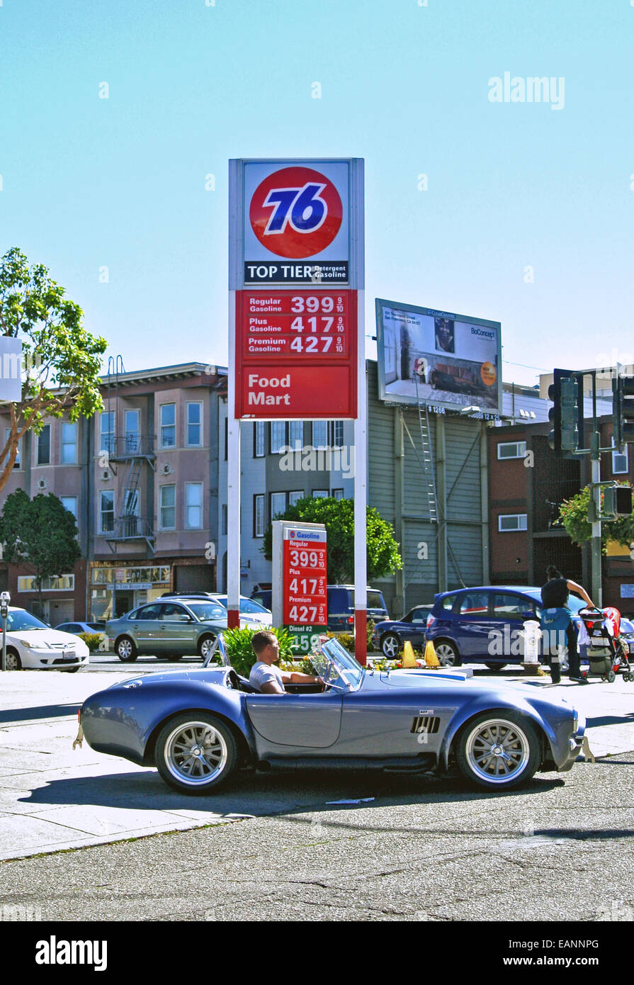 a corvette leaves a  76 gas station with prices over $4 dollars a gallon Stock Photo