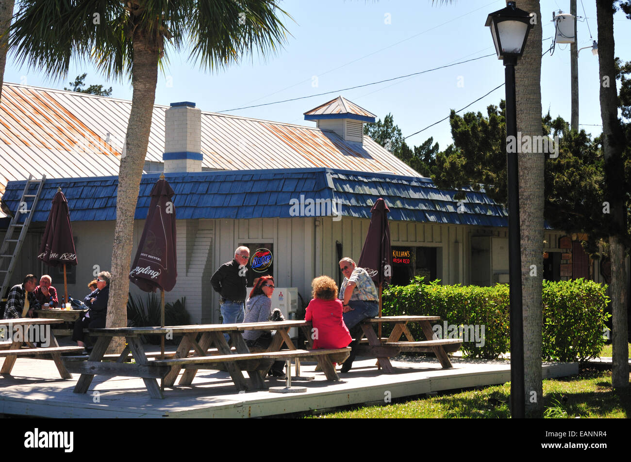 Diners outside Pecks seafood restaurant at Old Port Cove, Crystal River