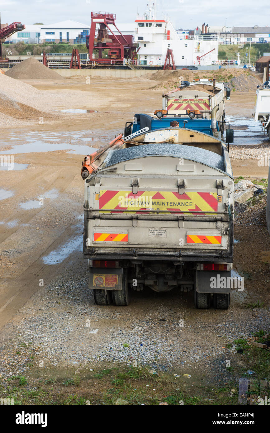 Highway maintenance trucks at cement yard near coast, Brighton Stock