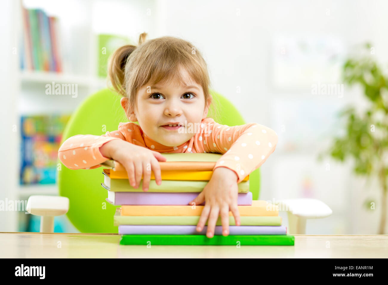 Cute child girl preschooler with books Stock Photo - Alamy