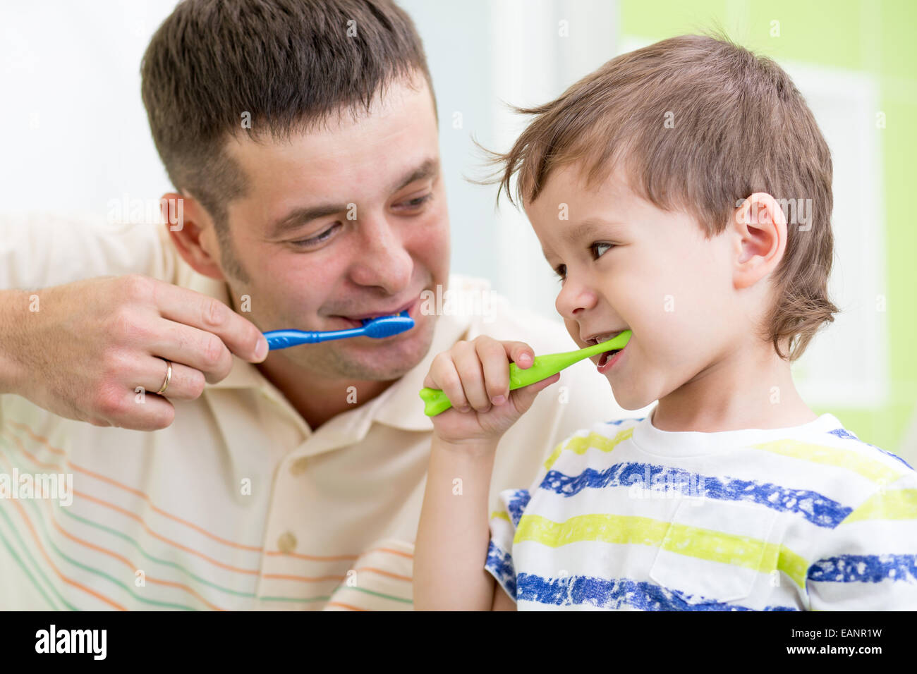father and kid son brushing teeth Stock Photo Alamy