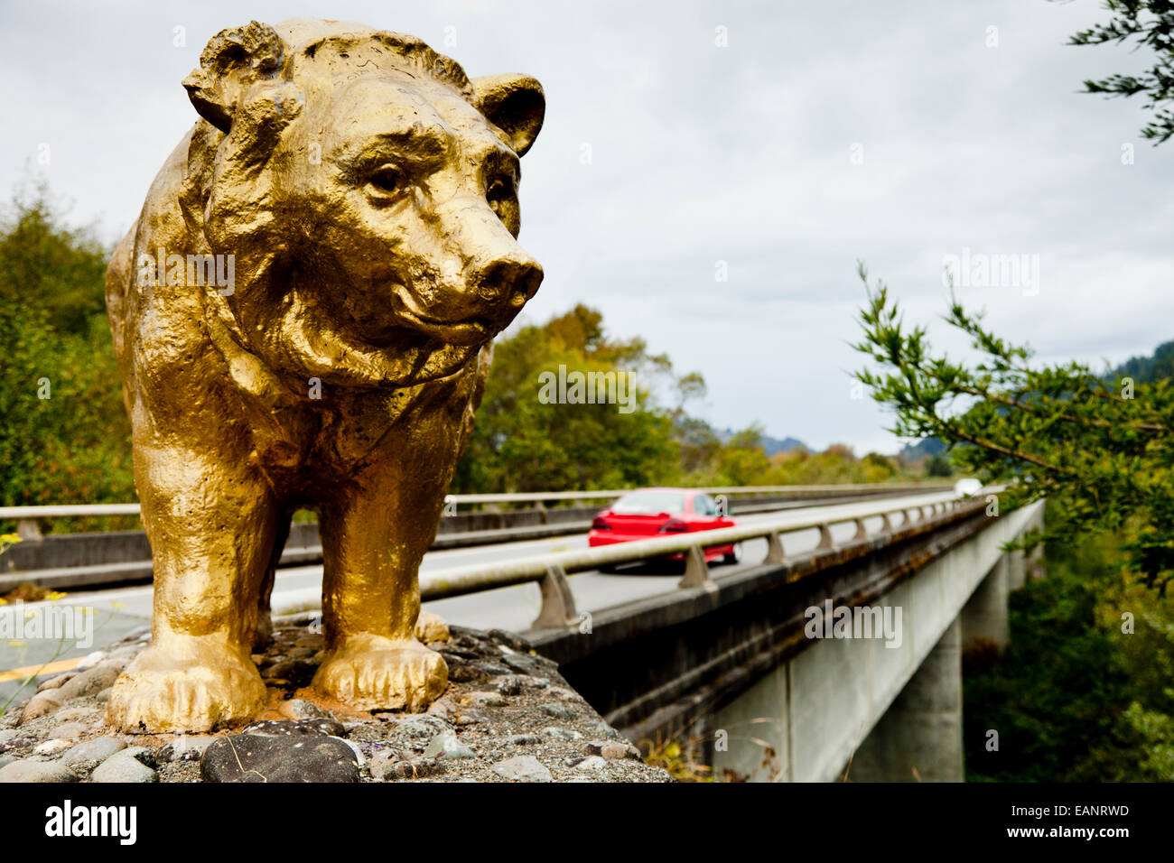 Golden bear on the bridge carrying Highway 101over the Klamath River, California USA Stock Photo