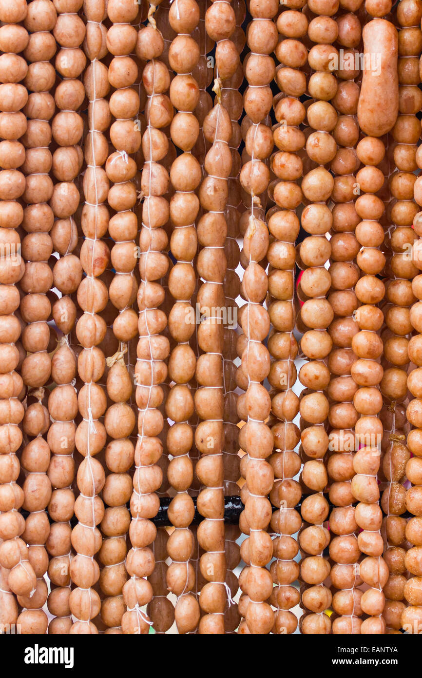 Traditional Thai food, pork sausage at street market, Thailand, background Stock Photo