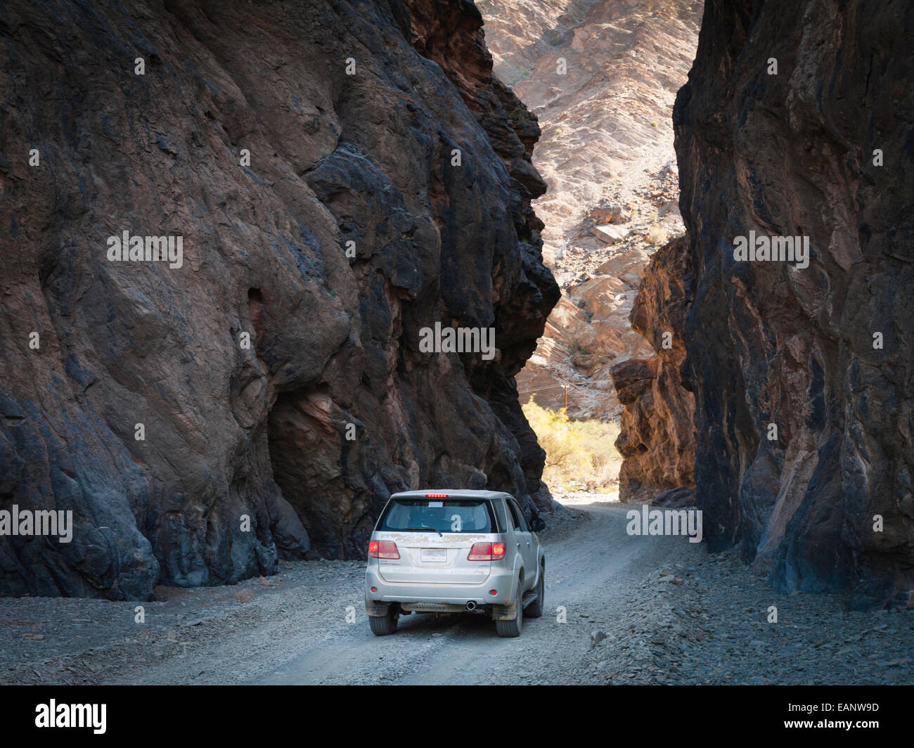 Road through canyon between Wadi As Sahtan and Wadi Bani Awf, Oman Stock Photo