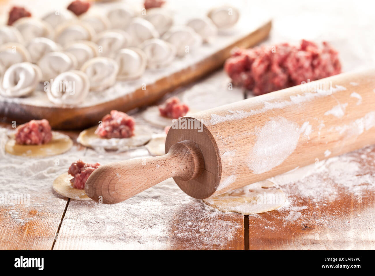 Dumplings. Uncooked on the wooden desk. Stock Photo