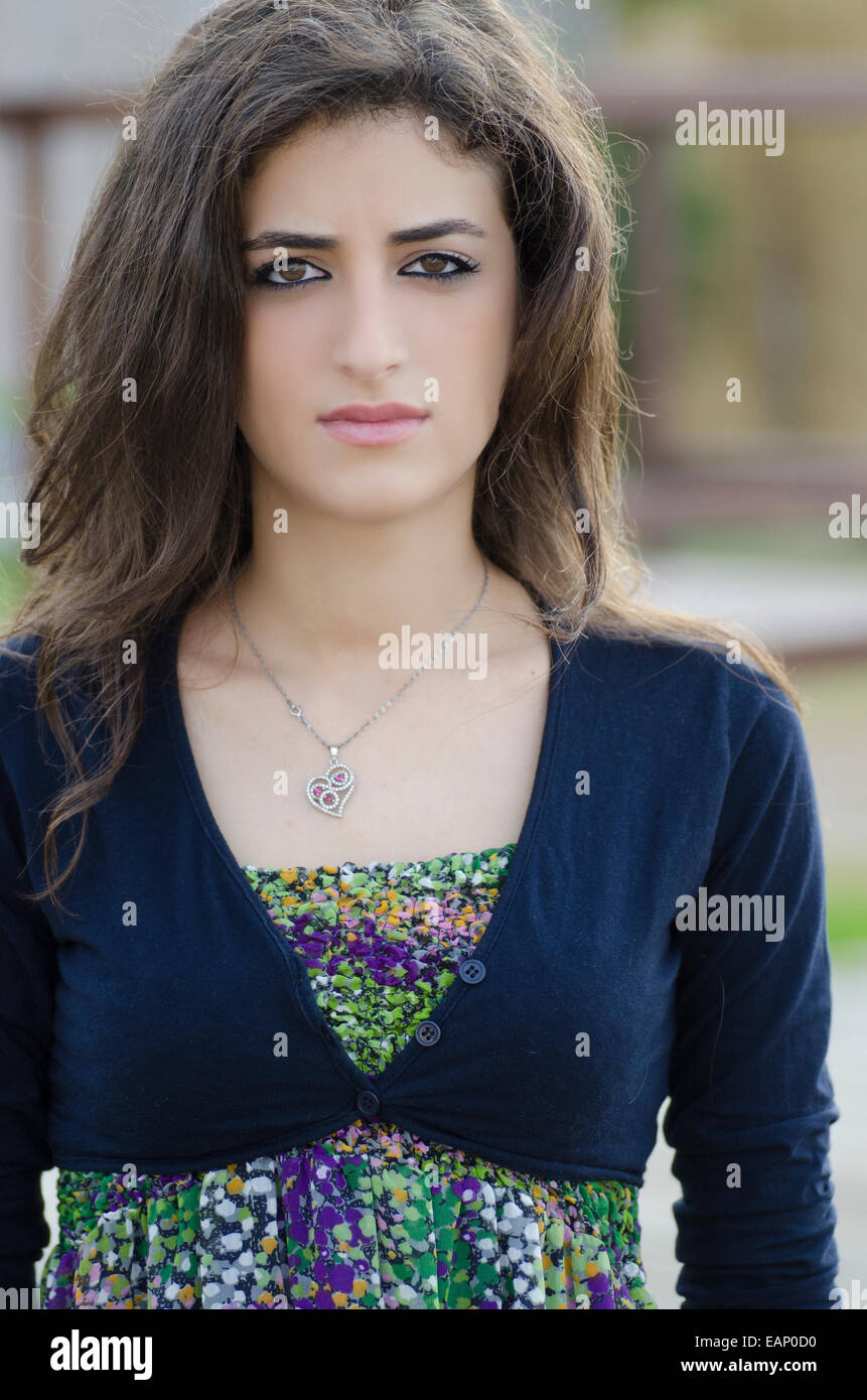 Portrait of a serious middle eastern woman outdoors Stock Photo