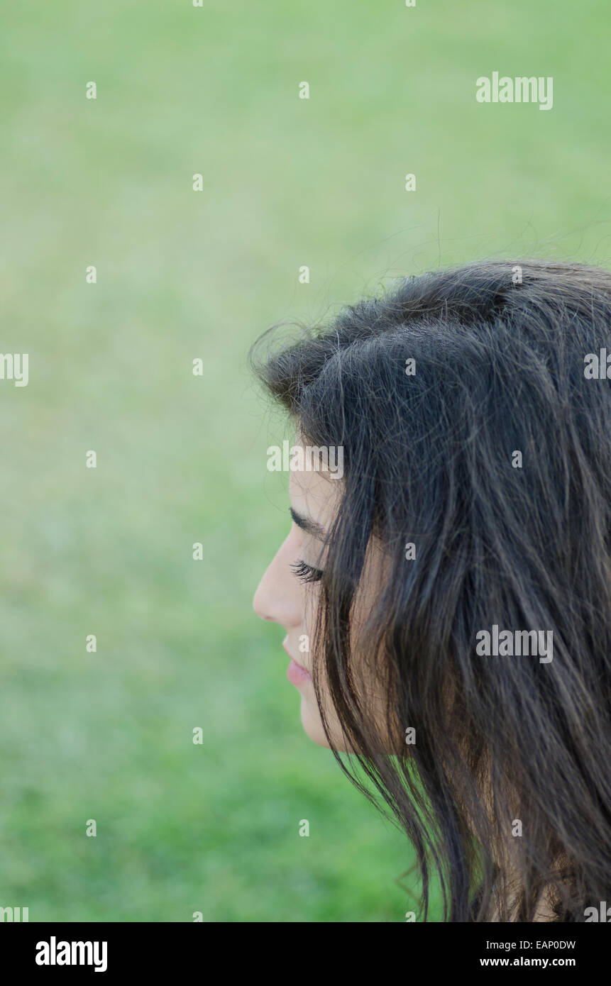 Young woman relaxing outdoors Stock Photo - Alamy