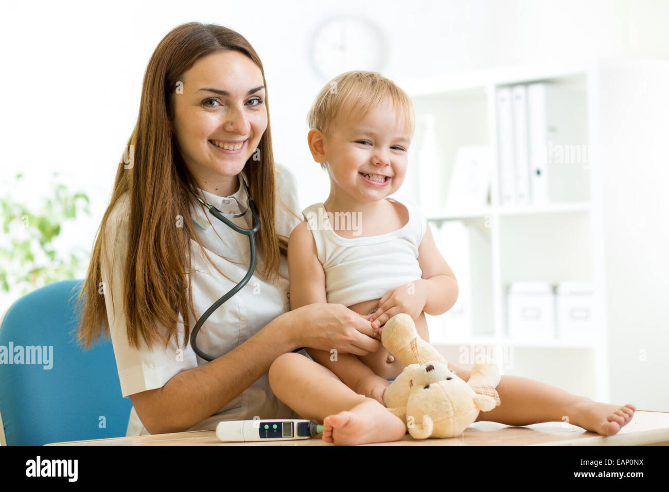 medic pediatrician examining of child with stethoscope Stock Photo