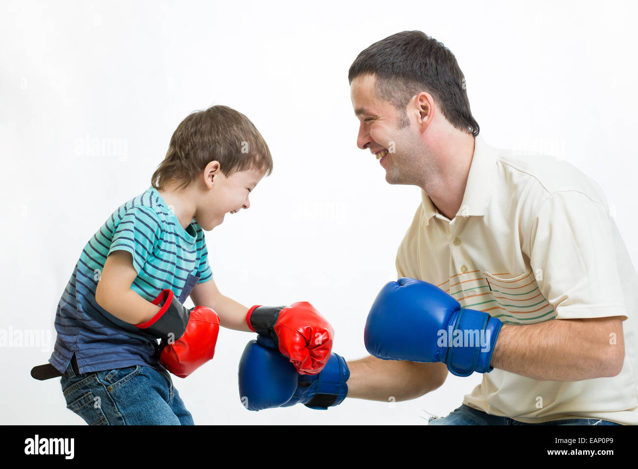 kid boy and dad play boxing Stock Photo