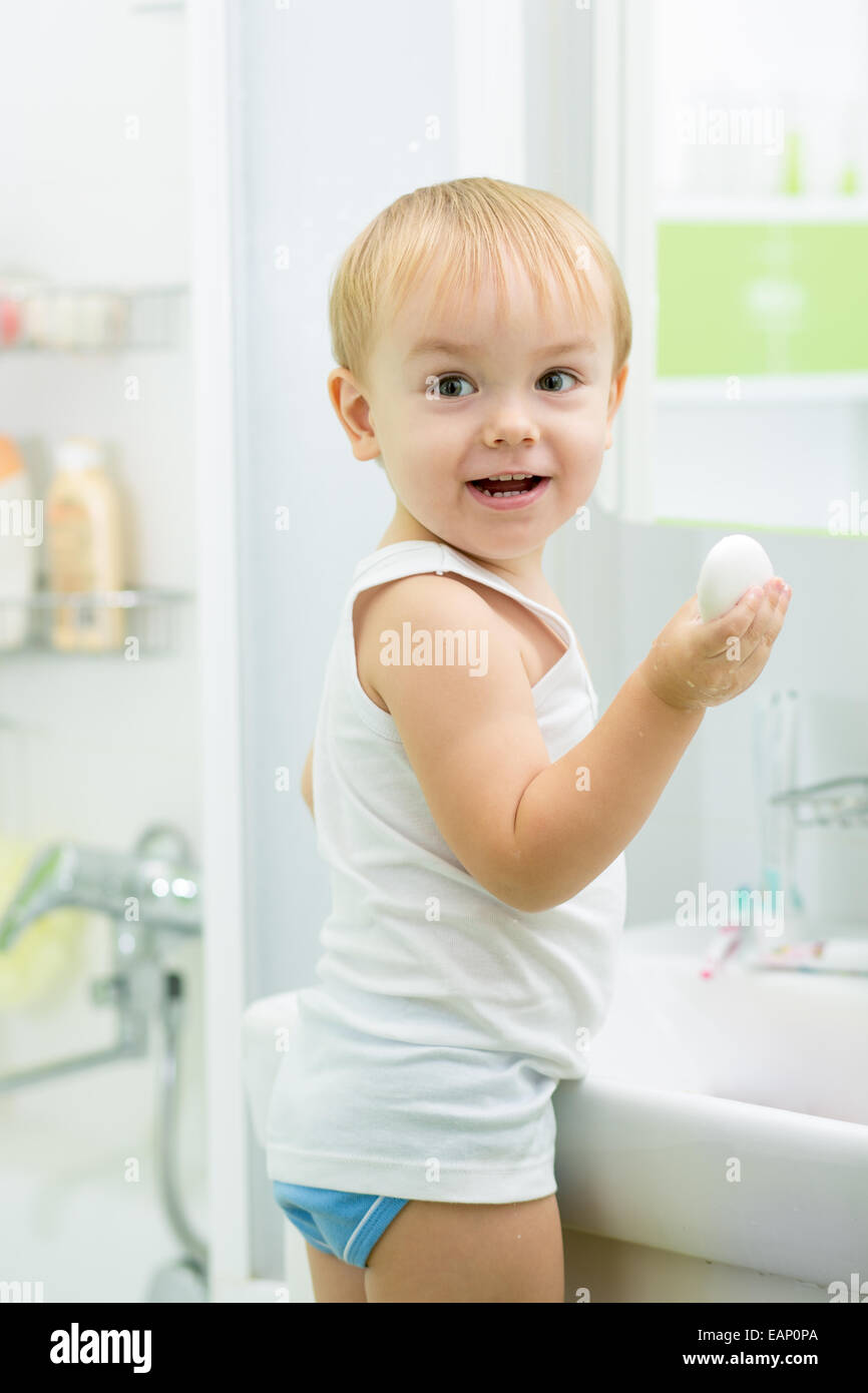 child toddler washing hands with soap in bathroom Stock Photo Alamy