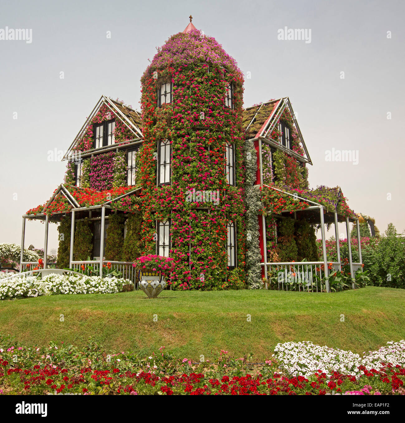 Spectacular floral display in Dubai Miracle Gardens, replica cottage