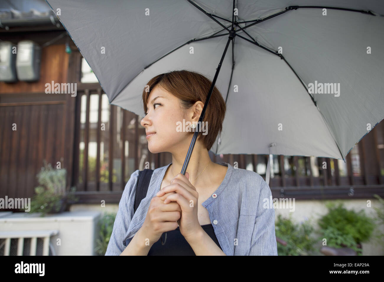 Woman standing outdoors hi-res stock photography and images - Alamy