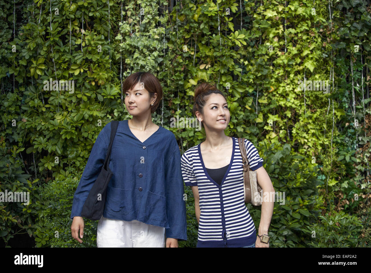 Two women standing side by side. Stock Photo