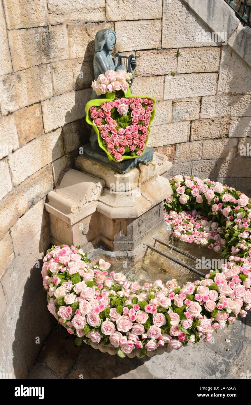 Fountain with wreath of roses Stock Photo