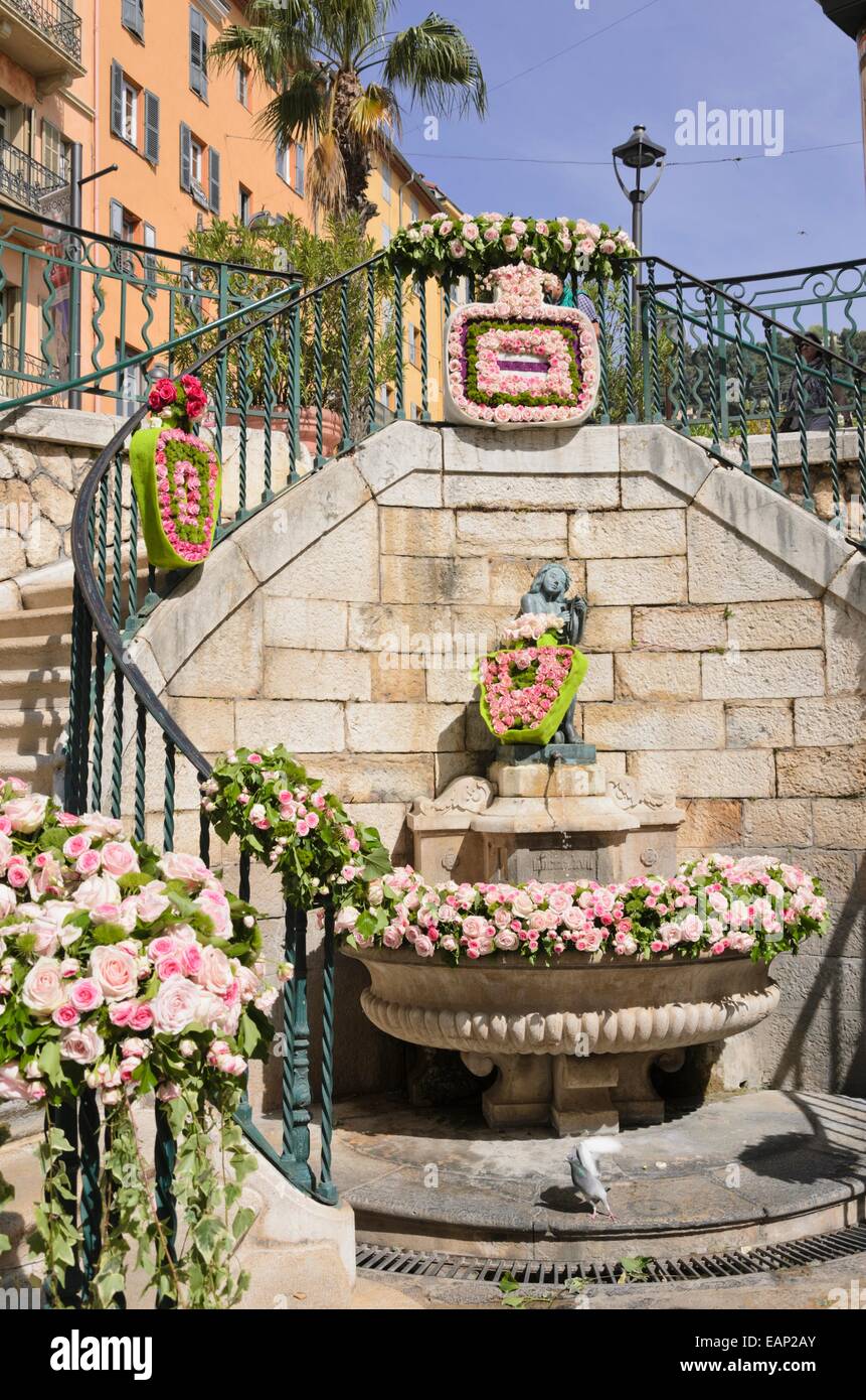Fountain with wreathes of roses Stock Photo