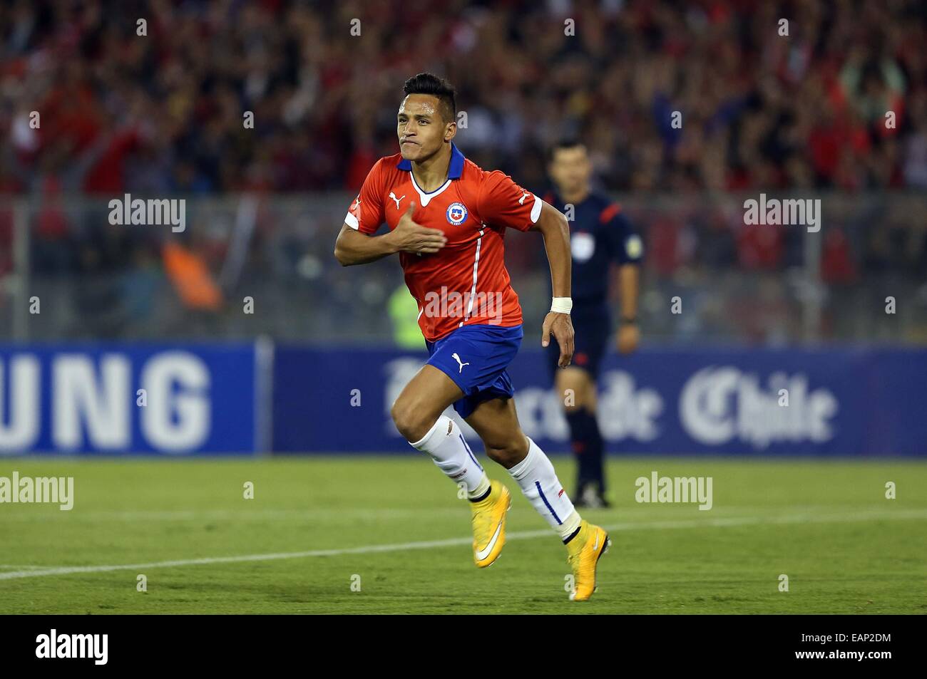 Santiago, Chile. 18th Nov, 2014. Image provided by National Association of Professional Soccer (ANFP, for its acronym in Spanish) of Chile shows Chile's Alexis Sanchez celebrating his goal during a friendly match against Uruguay, at Monumental Stadium, in Santiago, Chile, on Nov. 18, 2014. © ANFP/Xinhua/Alamy Live News Stock Photo