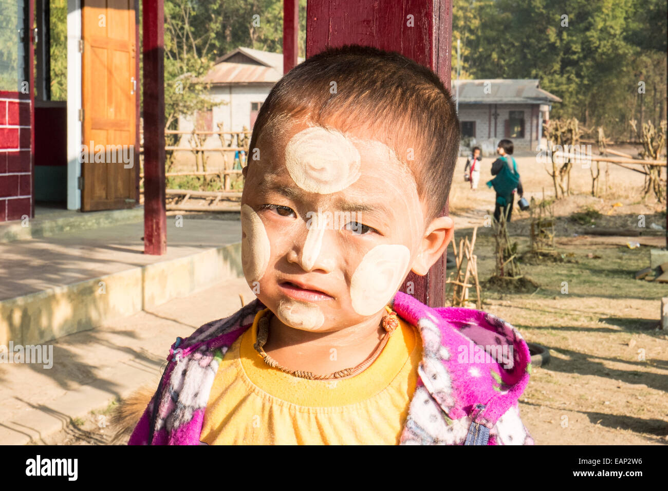 Children with face paint, traditional thanaka cream paste at local kindergarten school. South of Nyaungshwe,Inle Lake,Burma,Asia Stock Photo