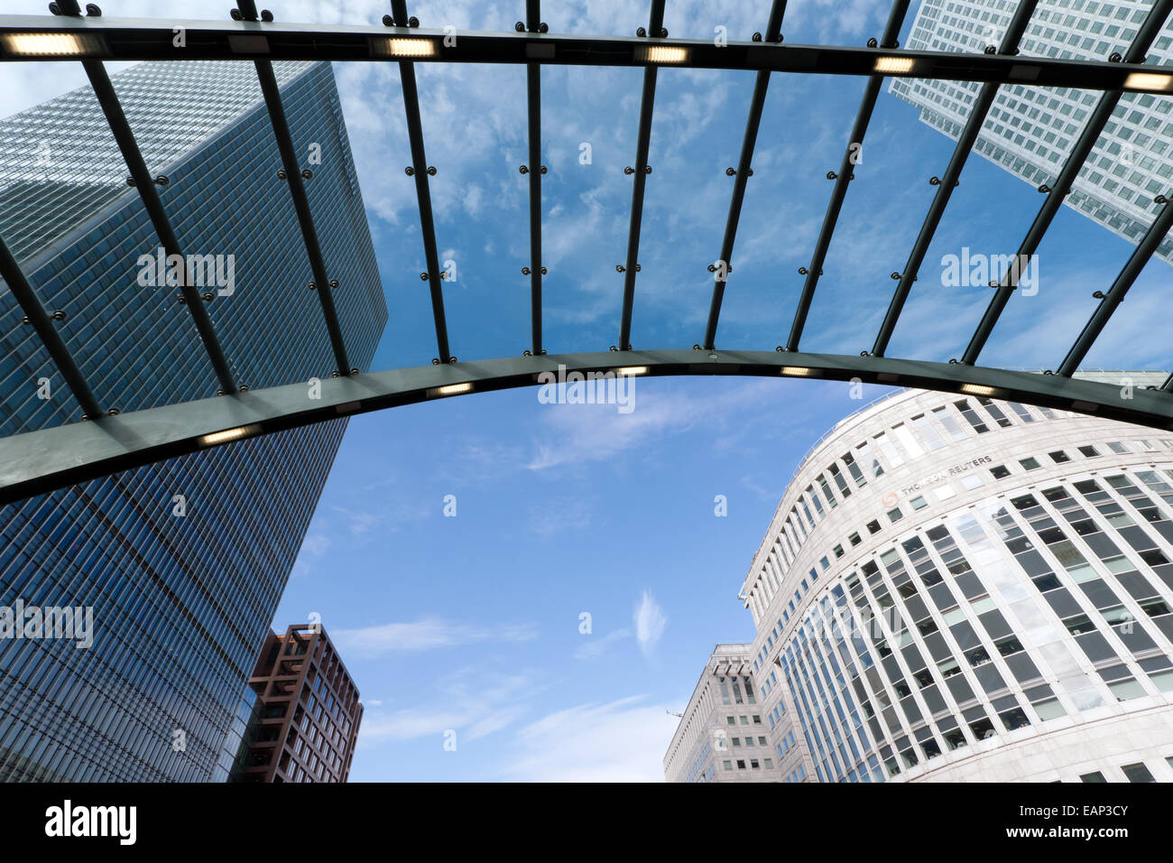 Wide-Angle view looking up, from  the entrance of Canary Wharf Station towards the  JP Morgan and  Thomson  Reuters  Buildings. Stock Photo