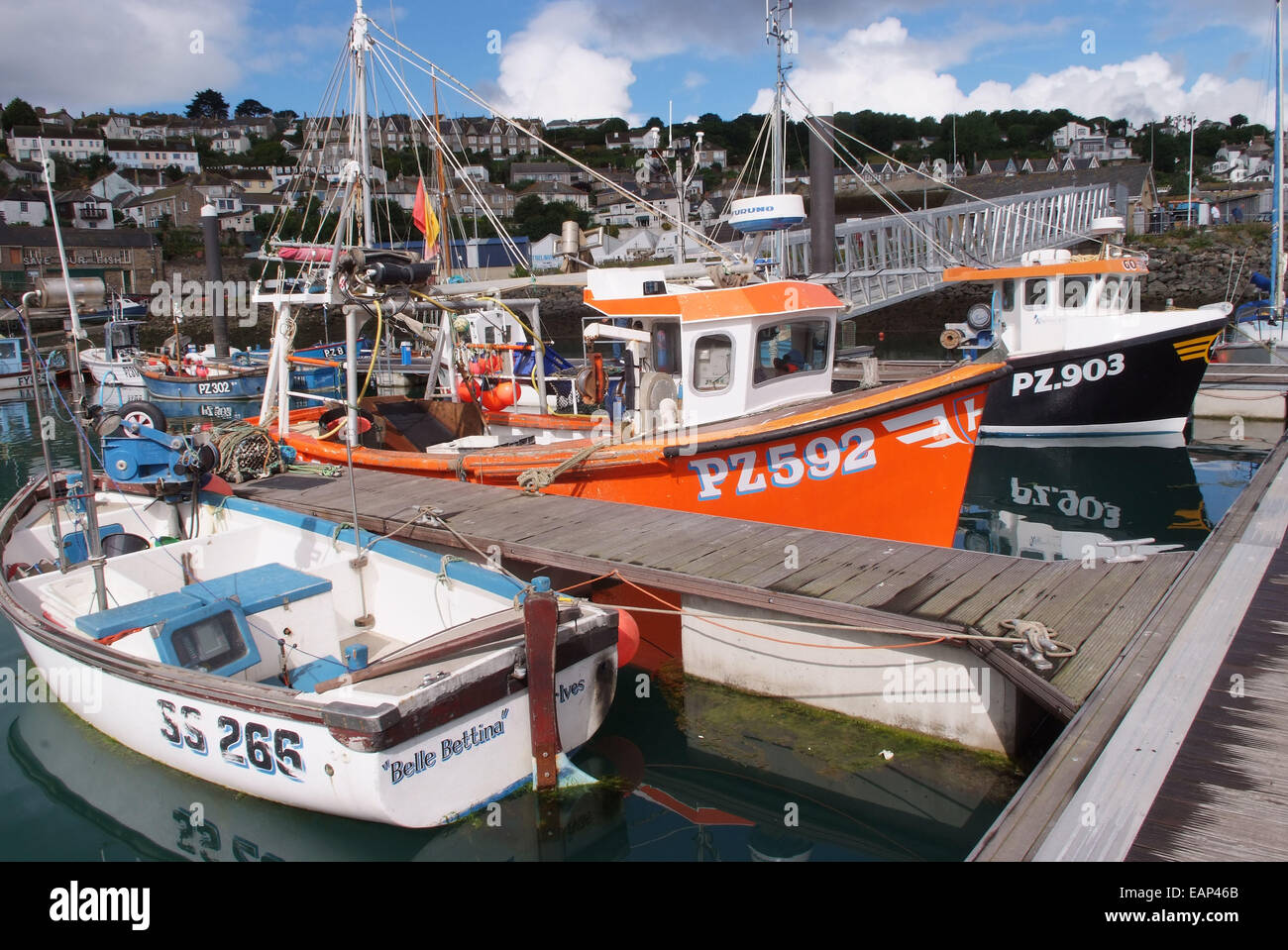 Newlyn harbour and marina, Cornwall, Uk, showing the catch of crabs being unloaded from a fishing boat Stock Photo