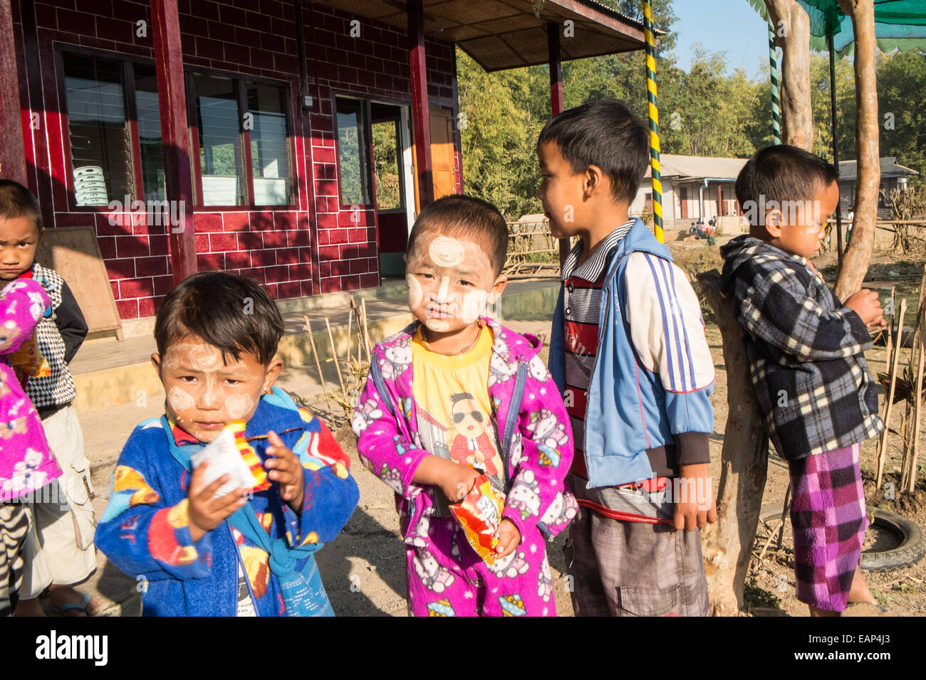 Children with face paint, traditional thanaka cream paste at local kindergarten school. South of Nyaungshwe,Inle Lake,Burma,Asia Stock Photo