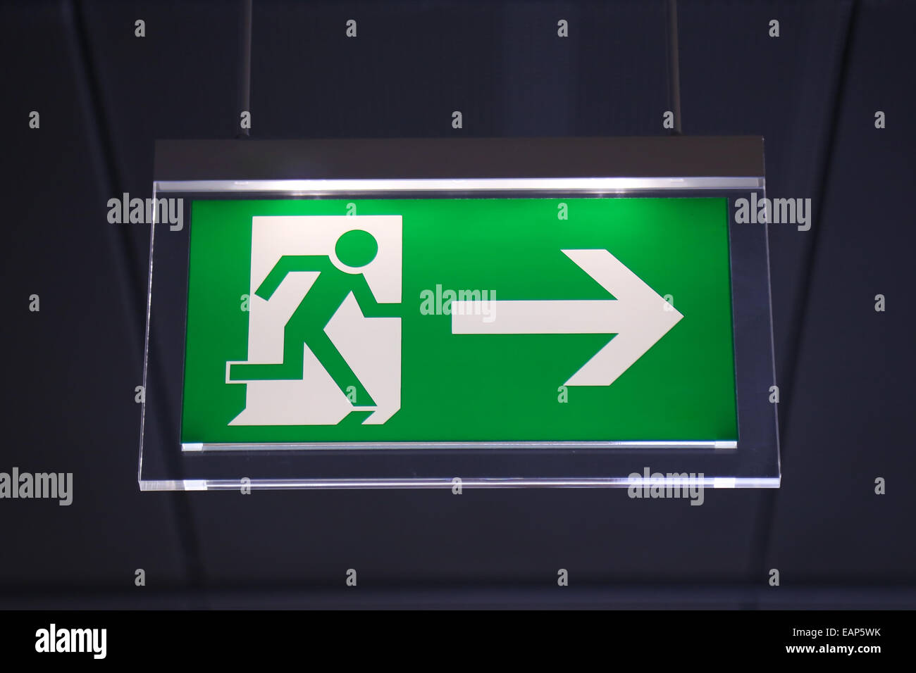 Emergency exit sign above a black doorway Stock Photo Alamy