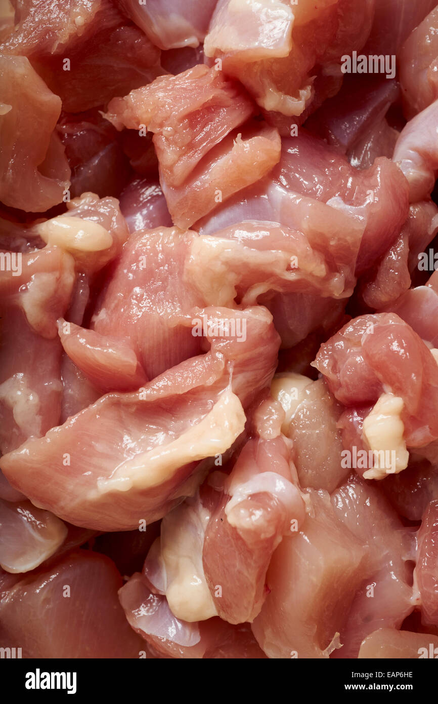 Bits of raw chicken thigh, ready for cooking Stock Photo