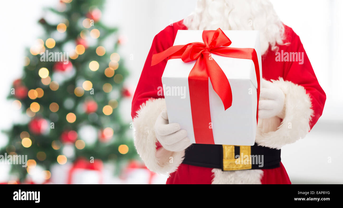 man in costume of santa claus with gift box Stock Photo - Alamy