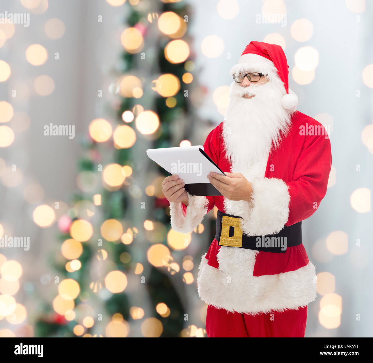 man in costume of santa claus with notepad Stock Photo - Alamy