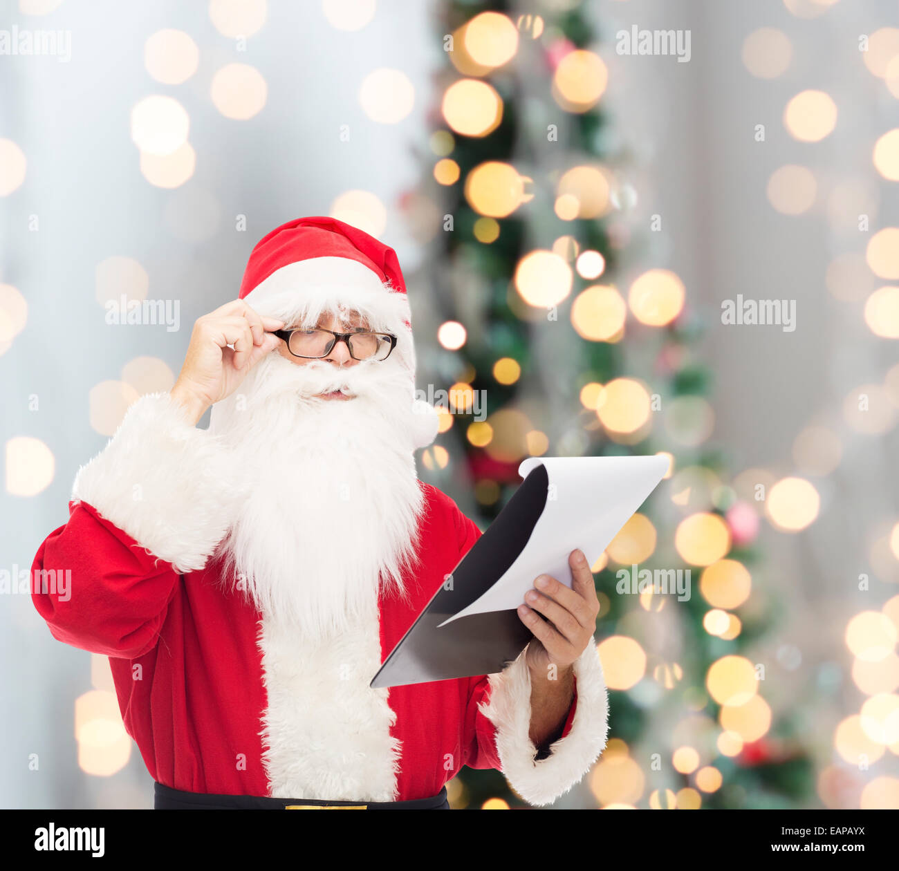 man in costume of santa claus with notepad Stock Photo - Alamy