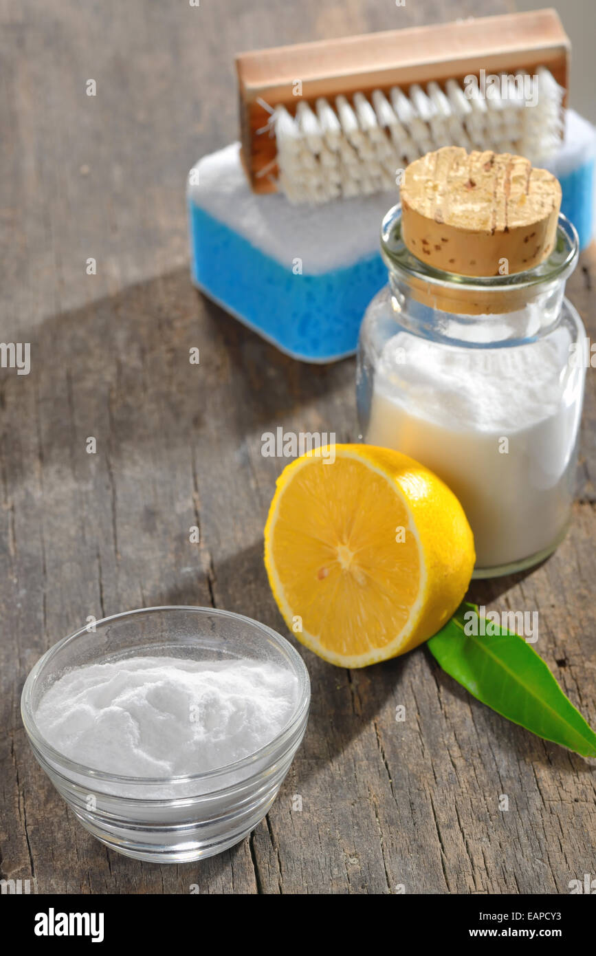 cleaning tools with lemon and sodium bicarbonate on wood Stock Photo