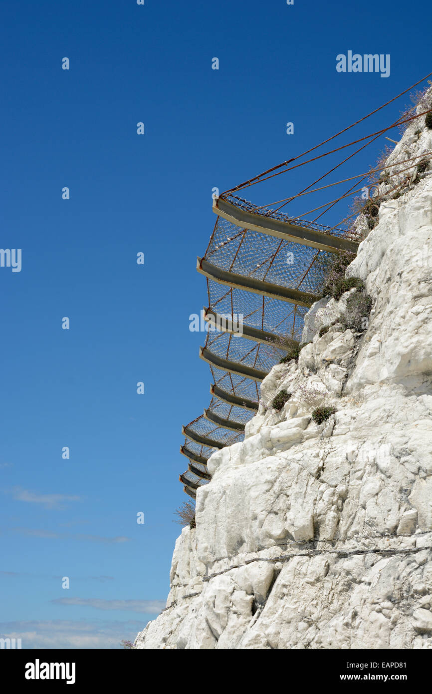 Safety netting on chalk cliffs to catch rock falls near Brighton. East