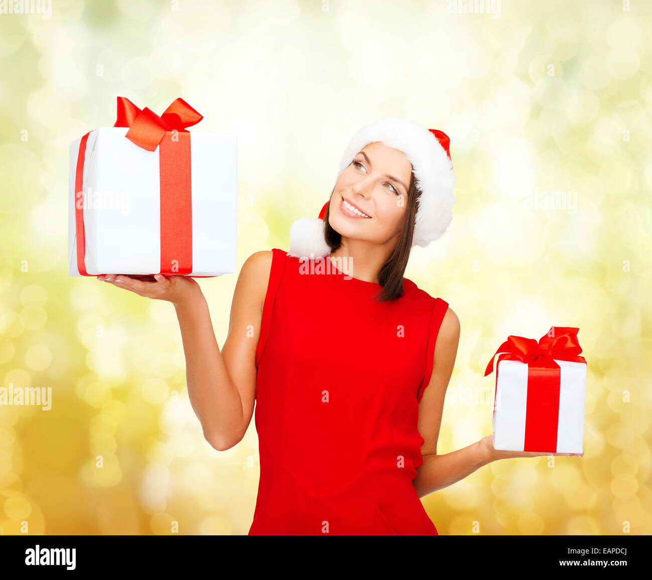 smiling woman in red dress with gift box Stock Photo Alamy