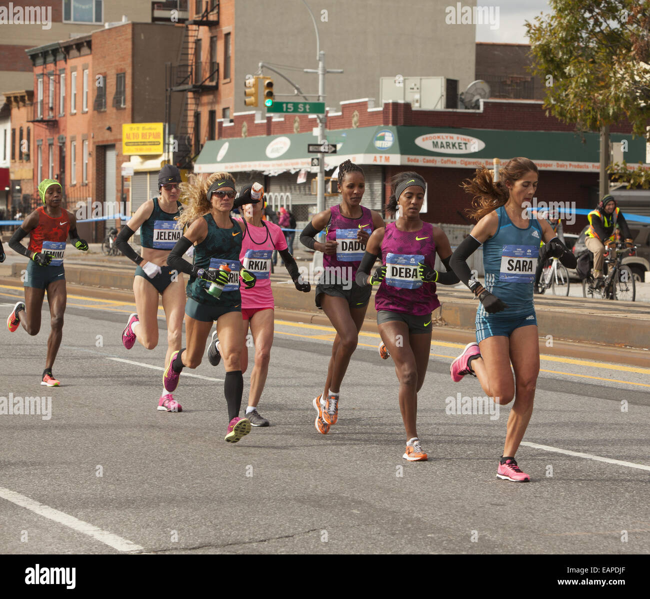2014 NY City Marathon: Female front  runners cruise along 4th Ave. in Brooklyn. Stock Photo