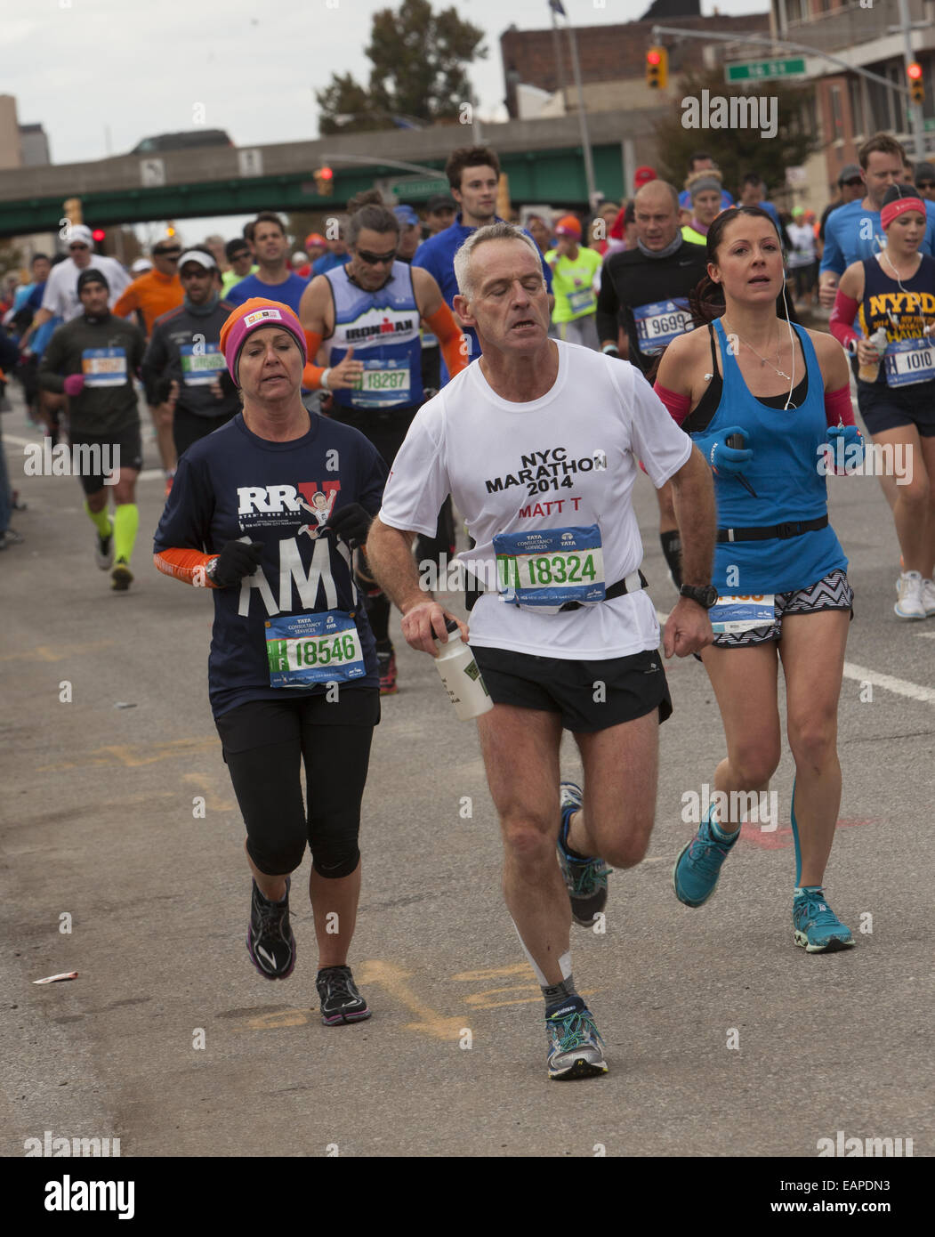 Older runners along 4th Avenue in Brooklyn in the NY Marathon. Stock Photo