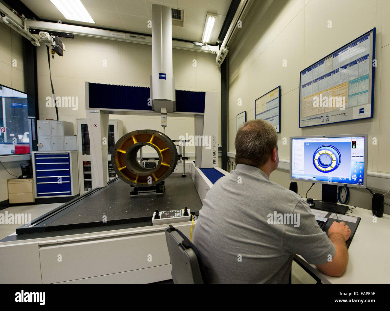 A Thyssenkrupp Elevator Factory Employee Checks A Traction Sheave For Stock Photo Alamy