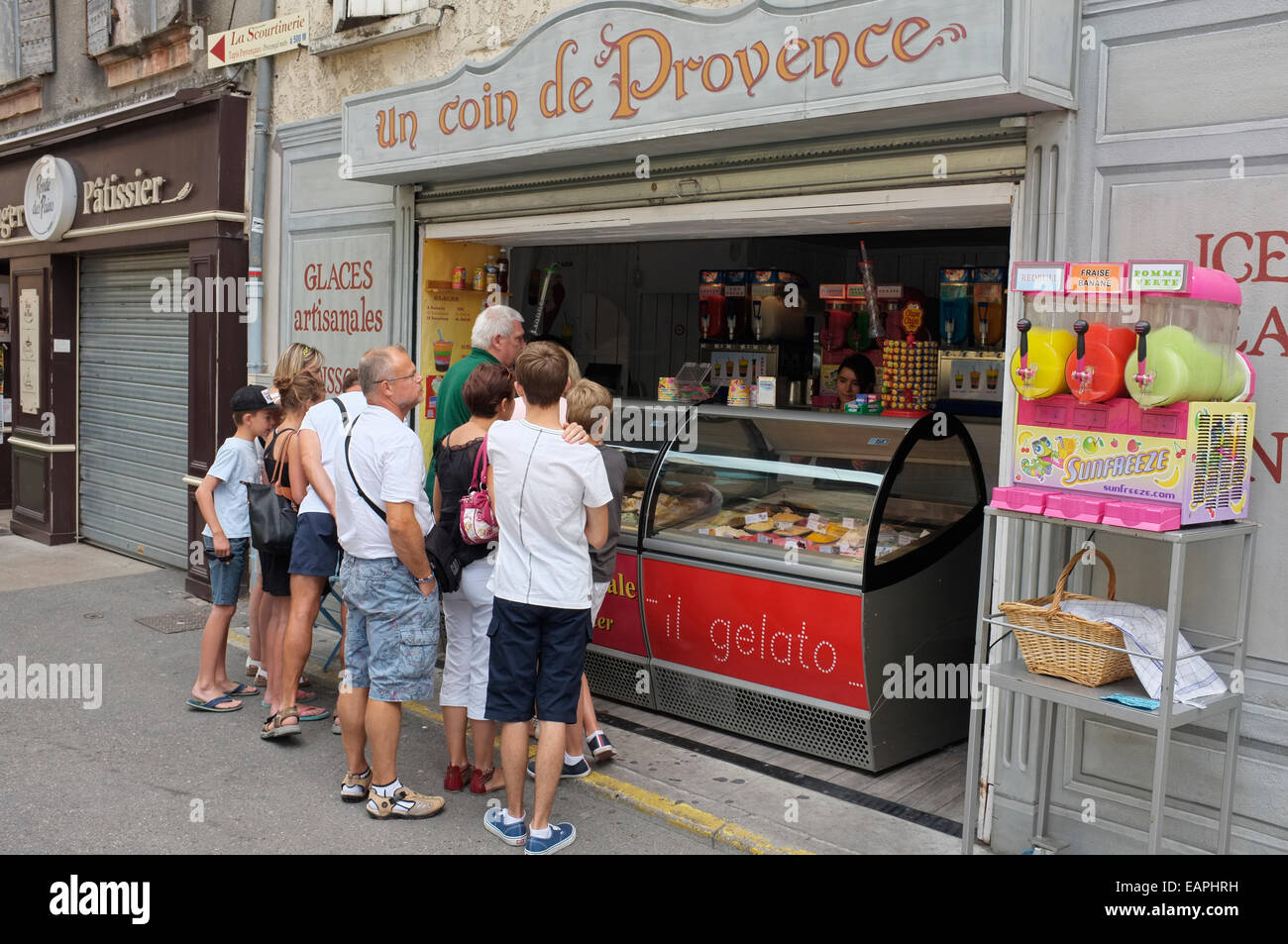 Customers queuing at an ice cream shop in Nyons, Drôme, France Stock