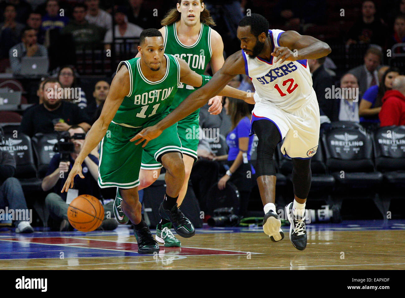 Philadelphia, Pennsylvania, USA. 19th Nov, 2014. Boston Celtics guard Evan Turner (11) brings the ball up the court with Philadelphia 76ers forward Luc Richard Mbah a Moute (12) defending during the NBA game between the Boston Celtics and the Philadelphia 76ers at the Wells Fargo Center in Philadelphia, Pennsylvania. Credit:  Cal Sport Media/Alamy Live News Stock Photo