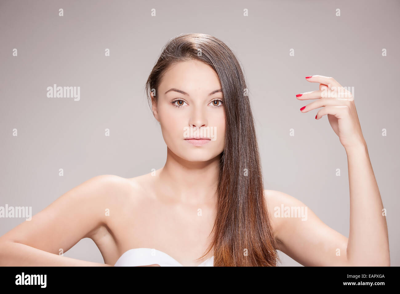 Attractive young woman with brown hair. Stock Photo
