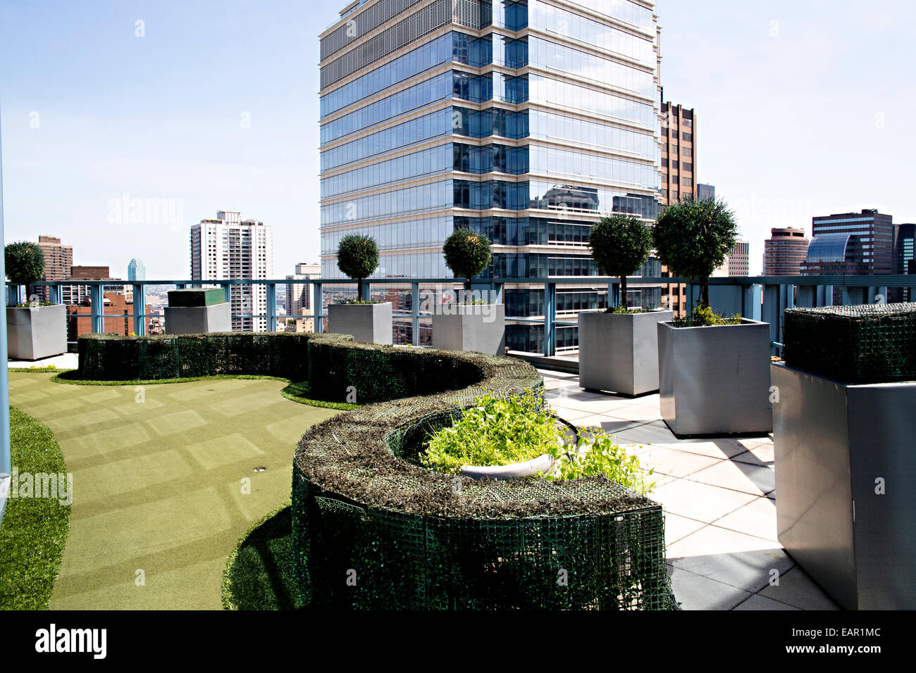 A miniature golf course is built on the top of floor 26 in a New York City building for employees. Stock Photo