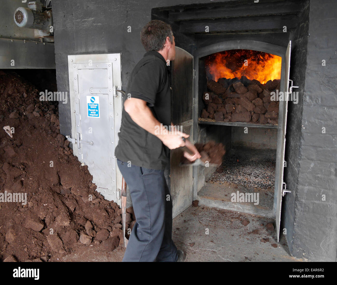 The peat oven kiln at Laphroaig distillery Islay Scotland Stock Photo