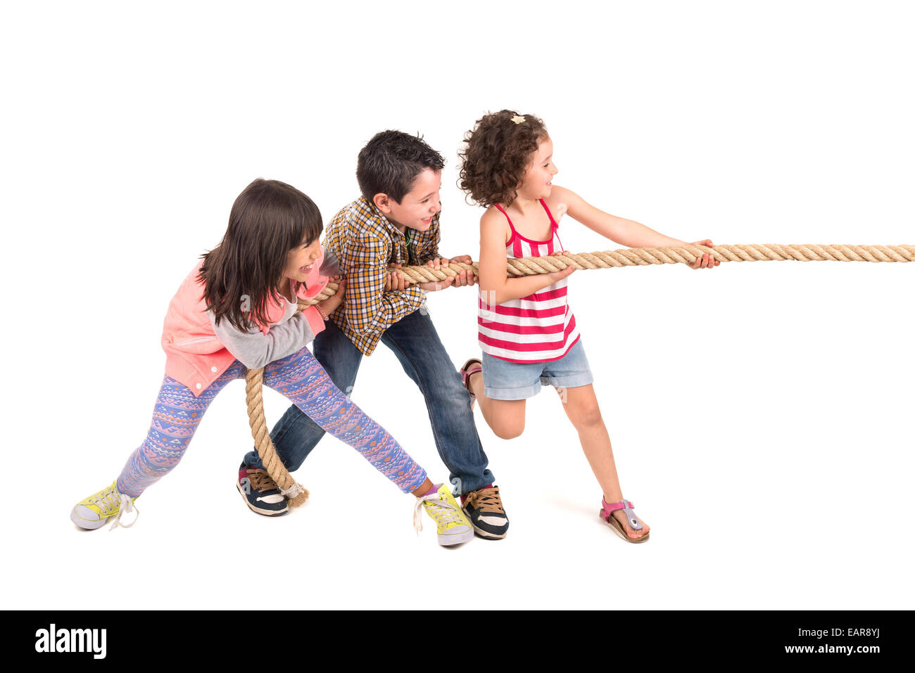Group of children in a ropepulling contest Stock Photo Alamy