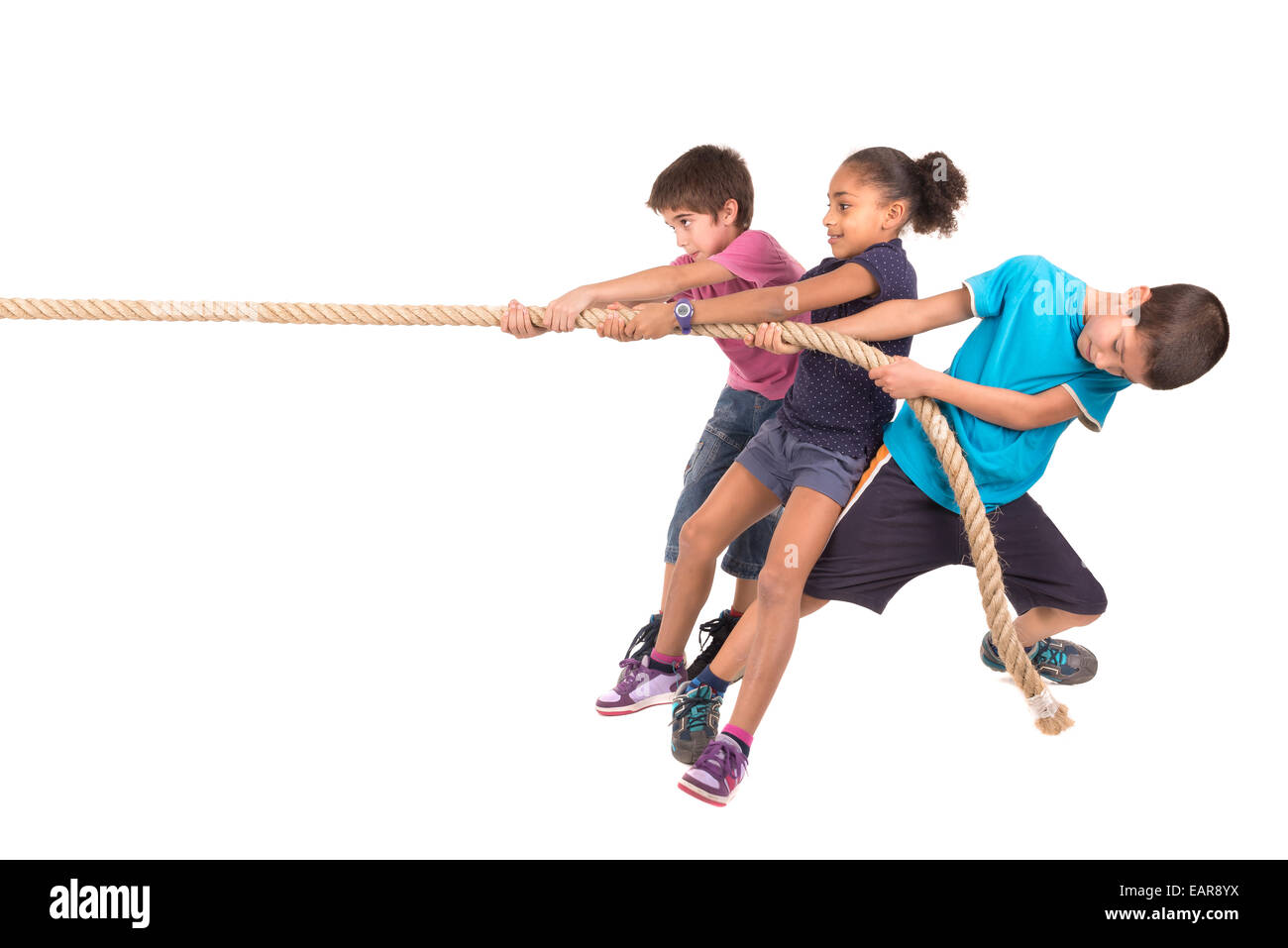 Group of children in a ropepulling contest Stock Photo Alamy