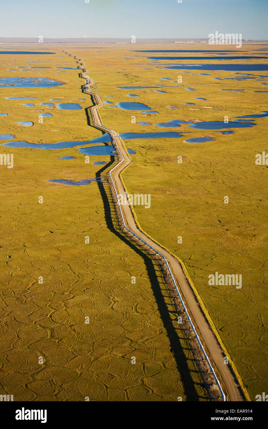 Aerial View Of Oil Gathering Lines Alongside A Dirt Road At Prudhoe Bay